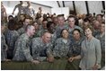 Mrs. Laura Bush poses for a photo with US troops during her visit to Bagram Air Force Base Sunday, June 8, 2008, in Bagram, Afghanistan.