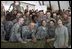 Mrs. Laura Bush poses for a photo with US troops during her visit to Bagram Air Force Base Sunday, June 8, 2008, in Bagram, Afghanistan.