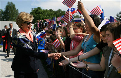 Mrs. Laura Bush is greeted by children waving flags as she and President George W. Bush arrive Tuesday, June 10, 2008, to attend the Lipizzaner Horse Exhibition at Brdo Castle in Kranj, Slovenia.
