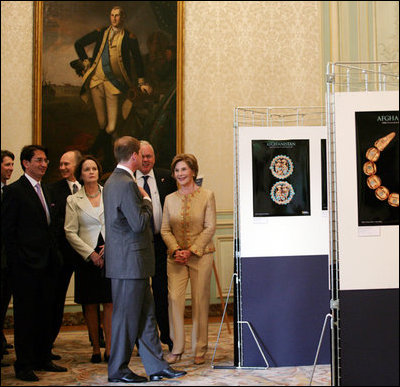 Mrs. Laura Bush participates in a viewing of the National Geographic Exhibits on Afghanistan led by Dr. Fredrick Hiebert, Archaeologist and Curator, National Geographic, Wednesday, June 11, 2008, during her visit to the Ambassador's Residence in Paris. Mrs. Bush is joined by U.S. Ambassador to France, Craig Stapleton, and his wife, Dorothy Stapleton.