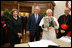 President George W. Bush and Laura Bush present Pope Benedict XVI with a framed photograph Friday, June 13, 2008, during their visit to the Vatican, The photo shows President Bush and Pope Benedict XVI together at the White House during the Pope's visit in April.