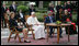 President George W. Bush and Mrs. Laura Bush meet June 13, 2008 in the Vatican Gardens with Pope Benedict XVI and Vatican Secretary of State Cardinal Tarcisio Bertone, where they watch the performance of The Pontifical Sistine Choir. 