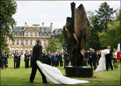 President George W. Bush and Laura Bush, accompanied by French President Nicolas Sarkozy, attend the unveiling of the Flamme de la Liberté sculpture Saturday, June 14, 2008, at the U.S. Ambassador's residence in Paris.