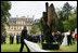 President George W. Bush and Laura Bush, accompanied by French President Nicolas Sarkozy, attend the unveiling of the Flamme de la Liberté sculpture Saturday, June 14, 2008, at the U.S. Ambassador's residence in Paris.