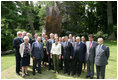 President George W. Bush, Laura Bush, and members of the U.S. delegation, join French President Nicolas Sarkozy and members of the French delegation, for a group photo following the unveiling of the Flamme de la Liberté sculpture Saturday, June 14, 2008, at the U.S. Ambassador's residence in Paris.