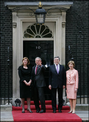 President George W. Bush waves to members of the media as he and Laura Bush are met by British Prime Minster Gordon Brown and his wife, Sarah, on their arrival Sunday, June 15, 2008 to 10 Downing Street in London.
