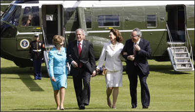 President George W. Bush and Laura Bush are met by U.S. Ambassador Robert Holmes Tuttle and his wife, Maria, Sunday, June 16, 2008, on their arrival to the ambassador's residence Winfield House in London.