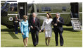 President George W. Bush and Laura Bush are met by U.S. Ambassador Robert Holmes Tuttle and his wife, Maria, Sunday, June 16, 2008, on their arrival to the ambassador's residence Winfield House in London.