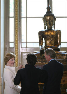 Mrs. Laura Bush is shown a statue during her tour the Afghani and Burmese Collections at the British Museum in London on Monday, June 16, 2008.