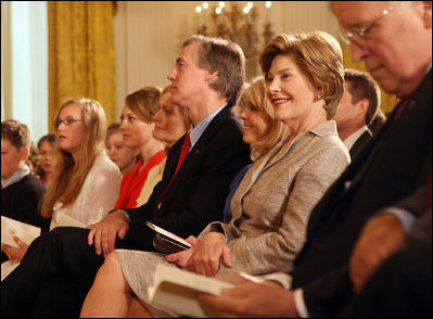 Mrs. Laura Bush smiles as she listens to the acknowledgments of the 2008 Presidential Medal of Freedom recipients during ceremonies Thursday, June 19, 2008, in the East Room of the White House.
