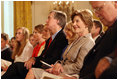 Mrs. Laura Bush smiles as she listens to the acknowledgments of the 2008 Presidential Medal of Freedom recipients during ceremonies Thursday, June 19, 2008, in the East Room of the White House.