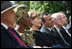 Mrs. Laura Bush listens to participants during a celebration of World Refugee Day Friday, June 20, 2008, in the East Garden of the White House. The event acknowledged the compassion of the American people in welcoming refugees into U.S. society and highlighting their contributions.