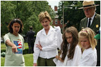 Mrs. Bush observes students of the Boys and Girls Club of Boston and Warren Prescott Elementary School who are planting gardens in the Charlestown Navy Yard Sunday, June 22, 2008 in Boston, MA, during a First Bloom event aimed at introducing children to plant species native to their area and educating kids about seed cultivation, garden design, and monitoring species.