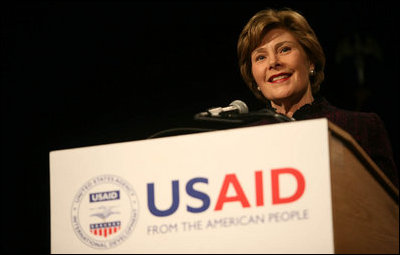 Mrs. Laura Bush delivers remarks Friday, March 7, 2008, during the USAID Celebration of International Women's Day at the Ronald Reagan Building in Washington, D.C. Mrs. Bush told her audience, "We're here today to tell our sisters around the world that we want them to join us. We're here to tell them that the long walk to freedom and equality, even though sometimes it might be a tiresome journey, that it's worth it. And the women of the United States are with them every single step of the way."