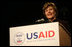 Mrs. Laura Bush delivers remarks Friday, March 7, 2008, during the USAID Celebration of International Women's Day at the Ronald Reagan Building in Washington, D.C. Mrs. Bush told her audience, "We're here today to tell our sisters around the world that we want them to join us. We're here to tell them that the long walk to freedom and equality, even though sometimes it might be a tiresome journey, that it's worth it. And the women of the United States are with them every single step of the way."