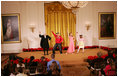 Mrs. Laura Bush, along with invited guests, watches a scene performance Friday, March 7, 2008 in the East Room of the White House, from the theater production of Chasing George Washington: A White House Adventure. The play is part of the Kennedy Center Performances for Young Audiences Series.