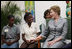 Mrs. Laura Bush speaks with a clinic patient and at risk adolescents during her visit Thursday, March 13, 2007 at the GHESKIO HIV/AIDS Center in Port-au-Prince, Haiti. GHESKIO is a participant in the President's Emergency Plan for AIDS Relief (PEPFAR), which has contributed approximately $365 million to fight HIV/AIDS in Haiti.