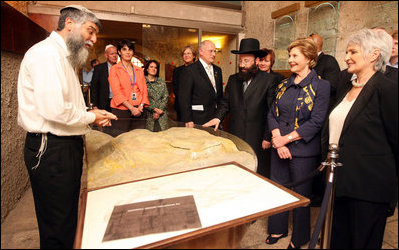 Mrs. Laura Bush and Mrs. Aliza Olmert, spouse of Israeli Prime Minister Ehud Olmert, listen to Mr. Mordechi Eliav, the Founder and Director of the Western Wall Heritage Foundation, during their visit to the Western Wall in Jerusalem Wednesday, May 14, 2008.