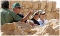 President George W. Bush and Mrs. Laura Bush stand with Mrs. Aliza Olmert, spouse of Israeli Prime Minister Ehud Olmert, as they listen to Eitan Campbell, Director of the Masada National Park, during a visit to the historic site Thursday, May 15, 2008, in Masada, Israel.