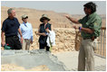 Director Eitan Campbell describes the water system of Masada to President George W. Bush, Mrs. Laura Bush and Mrs. Aliza Olmert, Thursday, May 15, 2008, as they tour the historic fortress built by King Herod of Judea, who ruled from 37 BC to 4 BC and chose the site as a refuge against his enemies and as a winter palace.
