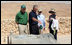 Prime Minister Ehud Olmert, Mrs. Laura Bush and Mrs. Aliza Olmert listen as President George W. Bush talks about the water system at Masada, the historic fortress built by King Herod of Judea. The couple's toured the National Park Thursday, May 15, 2008, during the visit to Israel by President and Mrs. Bush to help celebrate the 60th anniversary of the country's independence.