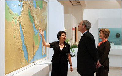 President George W. Bush and Mrs. Laura Bush listen to Director Amanda Weiss as they tour the Bible Lands Museum Jerusalem Friday, May 16, 2008. The museum illustrates the cultures of all the peoples mentioned in the Bible – from Egypt eastwards across the Fertile Crescent to Afghanistan, and from Nubia north to the Caucasian mountains.