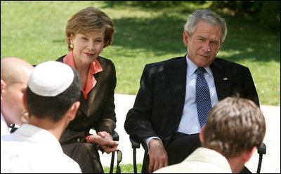 President George W. Bush and Mrs. Laura Bush listen to as a young participant during a roundtable discussion Friday, May 16, 2008, at the Bible Lands Museum Jerusalem. On the topic of peace with the Palestinians, the young student said, "I’m religious, but I want to give the Arabs land,’’ he said. "I feel I have a good life. Why don’t they get a good life too?"