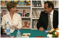 Mrs. Laura Bush smiles as she participates in a Big Read Egypt/U.S. roundtable discussion Sunday, May 18, 2008, with students at the Fayrouz Experimental School for Languages at Sharm El Sheikh. Mrs. Bush told the participants that the Big Read partnership will use literature to enhance understanding of each other’s societies and will also awaken the joy of reading in both Egyptians and Americans, particularly young people. Sitting with her is Dr. Yousry Saber Hussein El-Gamal, Minister of Education.