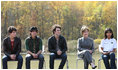 Mrs. Laura Bush is joined onstage by Boys and Girls Club student Jovanna Moreno age 11, right, and singer/songwriters the Jonas Brothers, Nick Jonas age 16, left, Joe Jonas age 19, 2nd from left, and Kevin Jonas age 20, 3rd left during a First Bloom event at the Trinity River Audubon Center, Sunday, November 2, 2008, in Dallas, TX.
