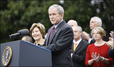 With Mrs. Laura Bush, the Vice President and Mrs. Cheney and Cabinet secretaries looking on, President George W. Bush addresses his staff Thursday, Nov. 6, 2008, on the South Lawn of the White House. Said the President, "As we head into this final stretch, I ask you to remain focused on the goals ahead. I will be honored to stand with you at the finish line."