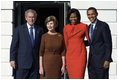 President George W. Bush and Mrs. Laura Bush and President-elect Barack Obama and Mrs. Michelle Obama pause for photographs Monday, Nov. 10, 2008, after the Obama's arrival at the South Portico of the White House.