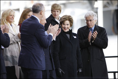 Mrs. Laura Bush acknowledges applause as she is introduced on stage Tuesday, Nov. 11, 2008, at the rededication ceremony for the Intrepid Sea, Air and Space Museum in New York.
