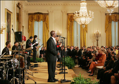 Mrs. Laura Bush listens as Berklee City Music group performs Friday, Nov. 14, 2008, during the Coming Up Taller Awards in the East Room of the White House.