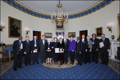 President George W. Bush and Mrs. Laura Bush stand with the recipients of the 2008 National Medal of Arts and Presidential Citizen Medal recipients in the Blue Room at the White House Monday, Nov., 17, 2008. Pictured from left, Henry 'Hank' Jones, Jr, jazz musician; Wayne Reynolds, president of the board of the Ford's Theatre Society; Stan Lee, legendary comic book creator; Paul Tetreault, director of the Ford's Theatre Society; Olivia de Havilland, actress; Carla Maxwell, artistic director of Jose Limon Dance Foundation; Hazel O'Leary, president of Fisk University and Paul Kwami, musical director for Fisk University Jubilee Singers; Dana Gioia, chairman of the National Endowment for the Arts; Adair Wakefield Margo, chairman for the President's Committee on Arts and Humanities; Jesus Moroles, sculptor; and Robert Capanna, of the Presser Foundation.