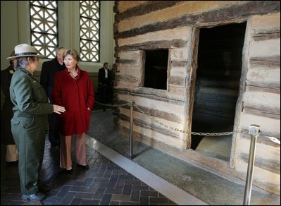Mrs. Laura Bush tours a replica Log Cabin of Abraham Lincoln's Birthplace during her visit to the Abraham Lincoln Birthplace National Historic Site Tuesday, Nov. 18, 2008, in Hodgenville, KY. Mrs. Bush is led on the tour by Ms. Sandy Brue, Chief of Interpretation and Resource Management, Abraham Lincoln Birthplace National Historic Site.