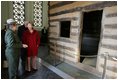 Mrs. Laura Bush tours a replica Log Cabin of Abraham Lincoln's Birthplace during her visit to the Abraham Lincoln Birthplace National Historic Site Tuesday, Nov. 18, 2008, in Hodgenville, KY. Mrs. Bush is led on the tour by Ms. Sandy Brue, Chief of Interpretation and Resource Management, Abraham Lincoln Birthplace National Historic Site.