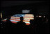 President George W. Bush is silhouetted against the renovated Star-Spangled Banner American flag exhibit Wednesday, Nov. 19, 2008, during his visit with Mrs. Laura Bush to the National Museum of American History in Washington, D.C. The flag, which flew above Fort McHenry in Baltimore during the British attack in 1814, inspired Francis Scott Key to write the lyrics that became our national anthem.