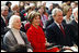 President George W. Bush and Mrs. Laura Bush smile as they participate Wednesday, Nov. 19, 2008, in the reopening of the National Museum of American History in Washington, D.C.