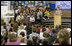 Mrs. Laura Bush addresses the Riverside Elementary School assembly in Bismarck, N.D., Thursday, Oct. 2, 2008, about the National Endowment for the Humanities' Picturing America' program. The program uses iconic artwork - such as the Washington Crossing the Delaware painting displayed nearby - and photography to teach children about architecture, art, and history as they discuss the images.