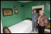 Mrs. Jean Coday, Director and President of the Laura Ingalls Wilder Historic Home and Museum, shows Mrs. Laura Bush the famous author's simple bedroom in Mansfield, Mo., Oct. 3, 2008. The home is where the "Little House" book series was written. Mrs. Bush, who is encouraging Americans to read our country's literary classics, noted that Laura Ingalls Wilder is an American author whose books have been loved by children and adults for over 70 years. The First Lady's mother read the books to her as a child before she could read. This week the home was designated a Save America's Treasures project.