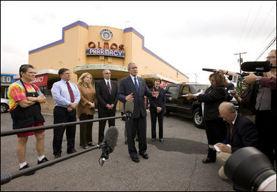 President George W. Bush and Mrs. Laura Bush are joined by local small business leaders for remarks on the economy Monday, Oct. 6, 2008, outside Olmos Pharmacy in San Antonio, Texas.