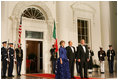 President George W. Bush and Mrs. Laura Bush welcome Italian Prime Minister Silvio Berlusconi Monday evening, Oct. 13, 2008, to the North Portico of the White House for a State Dinner in his honor.