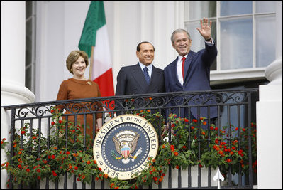 President George W. Bush andMrs. Laura Bush stand with Italian Prime Minister Silvio Berlusconi on the balcony of the South Portico of the White House Monday, Oct. 13, 2008, during Prime Minister Berlusconi's official welcome to the White House.