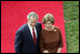 President George W. Bush and Mrs. Laura Bush stand together as they wait for the arrival of Prime Minister Silvio Berlusconi of Italy Monday, Oct. 13, 2008, during a South Lawn ceremony for the Prime Minister at the White House.