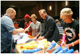 Mrs. Laura Bush, joined by Mrs. Cindy McCain, right, help HIV and AIDS advocate Princess Kasune Zulu, left, and One Chairman and CEO David Lane assemble care-giver packages at the ONE campaign event Tuesday, Sept. 2, 2008 at the Minneapolis Convention Center in Minneapolis, in support of health care workers who treat AIDS patients in African countries.