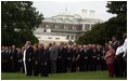 President George W. Bush and Mrs. Laura Bush stand with Vice President Dick Cheney and Mrs. Lynne Cheney and staff, family and friends Thursday, Sept. 11, 2008, in a South Lawn observance of the seventh anniversary of the September 11 terrorist attacks.
