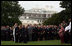 President George W. Bush and Mrs. Laura Bush stand with Vice President Dick Cheney and Mrs. Lynne Cheney and staff, family and friends Thursday, Sept. 11, 2008, in a South Lawn observance of the seventh anniversary of the September 11 terrorist attacks.