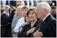 Mrs. Laura Bush stands with Vice President Dick Cheney during the National Anthem Thursday, Sept. 11, 2008, at the dedication ceremony for the 9/11 Pentagon Memorial at the Pentagon in Arlington, Va.