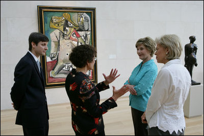 Mrs. Laura Bush stops in front of Pablo Picasso's painting 'Nude Man and Woman' as she is given a tour of the Nasher Sculpture Center by Acting Chief Curator Jed Morse, left, Trustee Nancy Nasher, gesturing, and Debbie Francis, right, Friday, Sept. 19, 2008 , in Dallas.