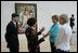 Mrs. Laura Bush stops in front of Pablo Picasso's painting 'Nude Man and Woman' as she is given a tour of the Nasher Sculpture Center by Acting Chief Curator Jed Morse, left, Trustee Nancy Nasher, gesturing, and Debbie Francis, right, Friday, Sept. 19, 2008 , in Dallas.